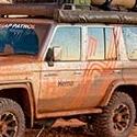 a car driving on a dirt road