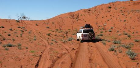a car driving through a desert