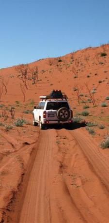 a car driving through a desert