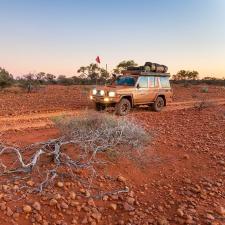 a car driving on a dirt road